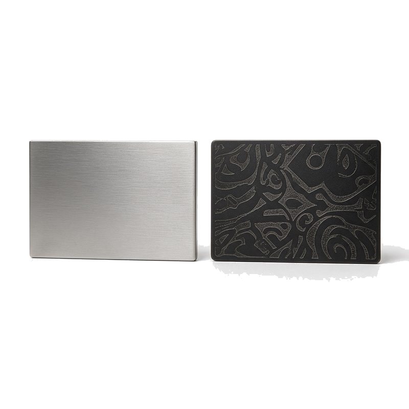 blank brushed steel card beside a laser etched black metal card for finish comparison