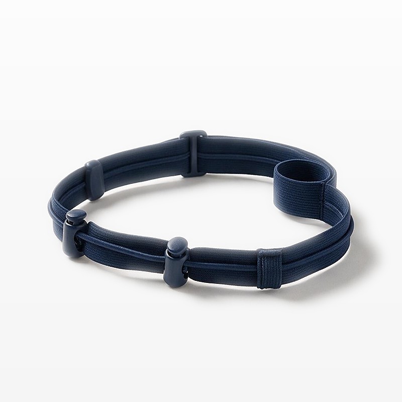 navy elastic race number belt looped on a white surface with two press-fit bib toggles and a slider on the webbing